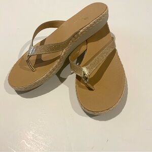 Women’s gold Tommy Bahama flip flop sandals